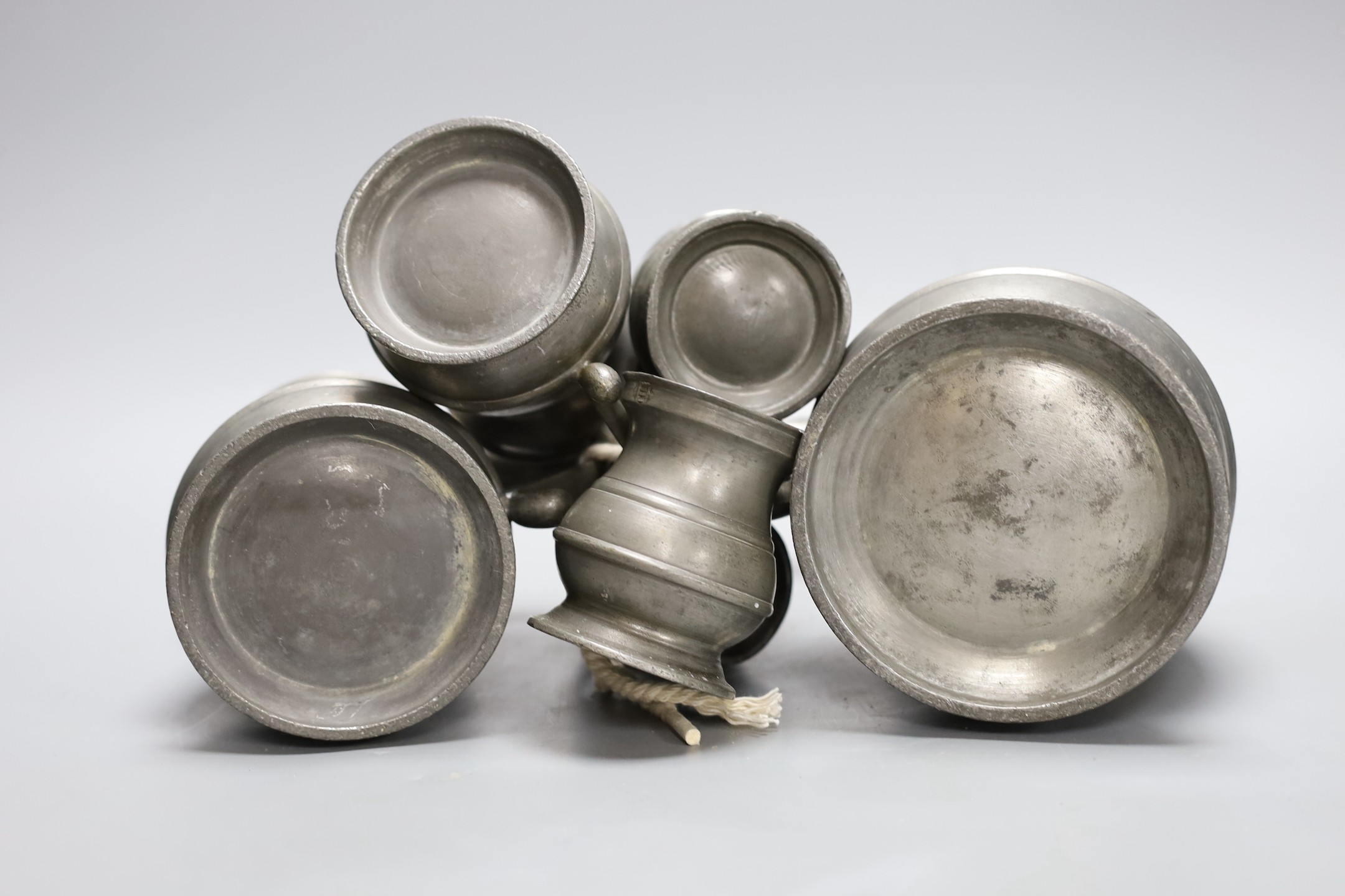 A set of six graduated pewter tankards, tallest 16 cms high